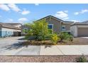 Attractive curb appeal with drought-tolerant landscaping at 21088 E Arroyo Verde Dr, Queen Creek, AZ 85142