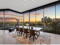 Elegant dining room with scenic views and a large glass wall at 4796 E Charles Dr, Paradise Valley, AZ 85253