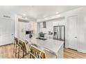 Modern kitchen with white cabinets, quartz countertops, and stainless steel appliances at 3131 N Central Ave # 3012, Phoenix, AZ 85012