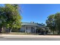 One-story home with a green metal roof, situated on a quiet street at 6405 N 75Th Ave, Glendale, AZ 85303