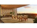 Spacious patio with dining area and mountain views at sunset at 4849 N Camelback Ridge Rd # A206, Scottsdale, AZ 85251