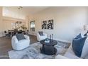 Modern dining room featuring a wood table and gray chairs at 17351 E Via Del Oro Dr, Fountain Hills, AZ 85268
