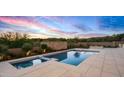 Stunning pool and spa with a fire feature, surrounded by a beautiful patio at 38152 N 109Th St, Scottsdale, AZ 85262