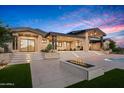 Luxury home with backyard patio, fire pit, pool, and stunning sunset view at 38152 N 109Th St, Scottsdale, AZ 85262