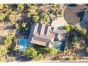 House with pool, basketball court, and lush landscaping at 6990 E Buckhorn Trl, Scottsdale, AZ 85266