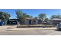 Small house with front yard and carport at 121 N 28Th Ave, Phoenix, AZ 85009