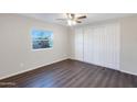 Spacious bedroom with large closet and wood-look flooring at 320 E Mckellips Rd # 44, Mesa, AZ 85201