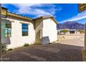 View of house exterior with mountain backdrop at 630 N Star Ct, Apache Junction, AZ 85119