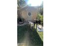 Ranch style home with a grassy yard and a wreath on the door at 915 W Tamarisk St, Phoenix, AZ 85041