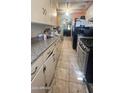 Kitchen with granite countertops and gas range at 915 W Tamarisk St, Phoenix, AZ 85041