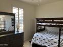 Bedroom with bunk beds and dresser at 4151 S Plasma --, Mesa, AZ 85212