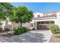 Beautiful home with a two-car garage and mature landscaping at 3529 N Hooper St, Buckeye, AZ 85396
