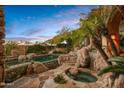 Relaxing pool and spa area with a natural rock landscape at 10040 E Happy Valley Rd # 676, Scottsdale, AZ 85255