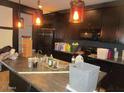 Kitchen with island and dark wood cabinets at 1069 W Elm Ave, Coolidge, AZ 85128