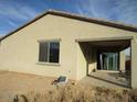 House with covered patio and desert landscaping at 1069 W Elm Ave, Coolidge, AZ 85128