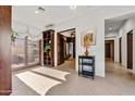 Long hallway with access to bedrooms and other areas of the home at 3105 S Amble Pass, Gold Canyon, AZ 85118