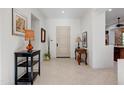 Bright entryway with tile flooring, console tables, and a view into the kitchen at 3105 S Amble Pass, Gold Canyon, AZ 85118