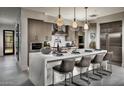 Modern kitchen with large island, stainless steel appliances, and ample counter space at 37200 N Cave Creek Road Rd # 1125, Scottsdale, AZ 85262