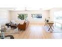 Spacious living room with light wood floors and ample seating at 16410 N 32Nd Pl, Phoenix, AZ 85032