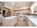 Well-equipped kitchen featuring stainless steel appliances and an island at 1873 E Mcnair Dr, Tempe, AZ 85283