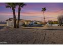 Single story home with a backyard and palm trees at 12819 N 111Th Ave, Sun City, AZ 85351
