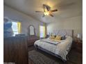Spacious main bedroom with a king-size bed and plenty of storage at 650 N Hawes Rd # 3202, Mesa, AZ 85207