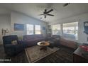 Comfortable living room with tiled floor and ample natural light at 650 N Hawes Rd # 3202, Mesa, AZ 85207