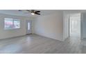 Bright and airy living room with light wood-look floors and ceiling fan at 4522 N 14Th Ave, Phoenix, AZ 85013