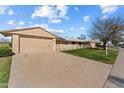 House exterior with a driveway, garage, and landscaping at 10712 W Cameo Dr, Sun City, AZ 85351