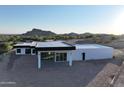 Aerial view of a modern home with mountain views at 3525 S Kings Ranch Ct # 4, Gold Canyon, AZ 85118