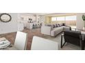 Open concept living and kitchen area with modern design at 17227 W Middlebury St, Surprise, AZ 85388