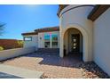 Front entry with paved walkway and decorative rock accents at 17807 E Silver Sage Ln, Rio Verde, AZ 85263