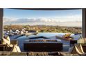 Covered patio with fire pit overlooking the mountains at 41851 N 112Th Pl, Scottsdale, AZ 85262