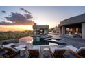 Expansive pool and patio with sunset views at 41851 N 112Th Pl, Scottsdale, AZ 85262