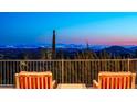 Panoramic city views from a balcony with chairs at 11070 E Rolling Rock Dr, Scottsdale, AZ 85262