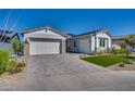Modern two-story home with a white facade and a landscaped yard at 17316 W Wildwood St, Surprise, AZ 85388