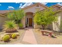 Inviting front yard with desert landscaping and walkway to the entrance at 39012 N 8Th St, Phoenix, AZ 85086