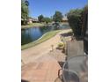 Calm lake view with walking path and lush greenery at 427 Leisure World --, Mesa, AZ 85206