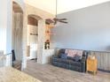 Relaxing living room featuring a leather couch and built-in shelving at 6547 E Sierra Morena St, Mesa, AZ 85215