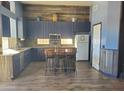 Kitchen with island, wood cabinets and granite at 6547 E Sierra Morena St, Mesa, AZ 85215
