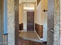 Inviting entryway with wood and tile accents and a dark door at 6547 E Sierra Morena St, Mesa, AZ 85215