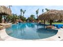 Resort-style pool with rock waterfall and tiki bar at 602 W Ridgecrest Rd, Phoenix, AZ 85086