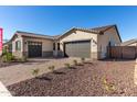 Single-story home with two-car garage and landscaped front yard at 24030 N 171St Dr, Surprise, AZ 85387