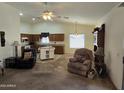 Open living room featuring a kitchen and comfortable seating at 2101 S Meridian Rd # 215, Apache Junction, AZ 85120