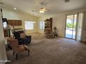 Bright living room with comfortable seating and access to backyard at 2101 S Meridian Rd # 215, Apache Junction, AZ 85120