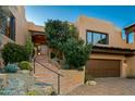 Front entry with stairs and attractive landscaping at 10284 E Filaree Ln, Scottsdale, AZ 85262