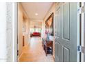 Bright and spacious entryway with tile flooring and a view into the living room at 28436 N 123Rd Ln, Peoria, AZ 85383