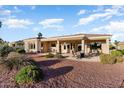 Relaxing backyard patio with seating area and golf course view at 22838 N De La Guerra Dr, Sun City West, AZ 85375