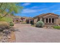 Elegant home with stone accents and a grand entrance at 11475 E Paradise Ln, Scottsdale, AZ 85255