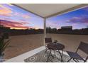 Small backyard patio with seating area and sunset view at 18361 E Eloisa Dr, Gold Canyon, AZ 85118